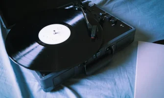 A classic vinyl record playing on a vintage turntable, evoking nostalgia and retro vibes