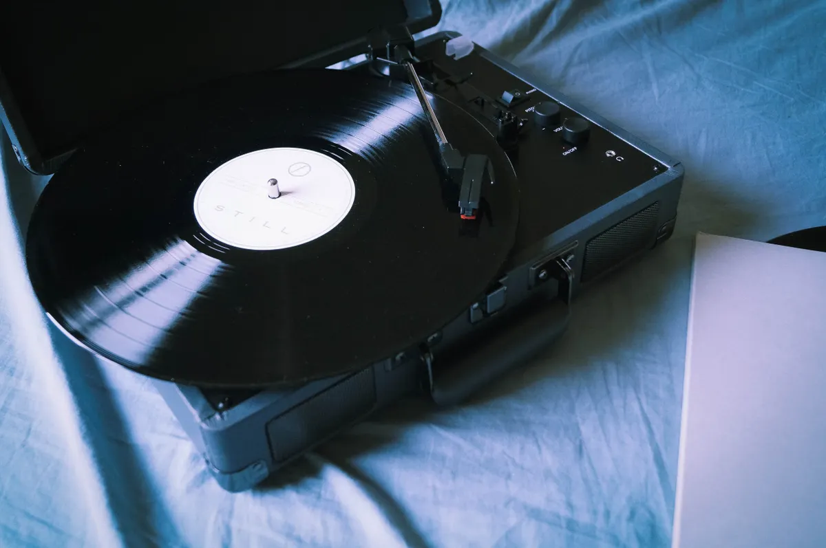 A classic vinyl record playing on a vintage turntable, evoking nostalgia and retro vibes